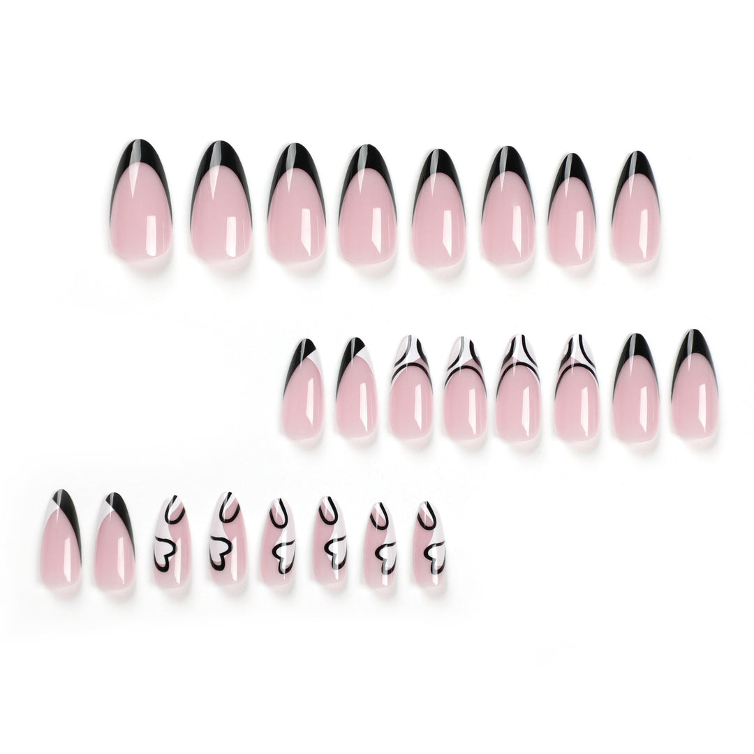 Artful stiletto nails with elegant black-and-white design Bowlift