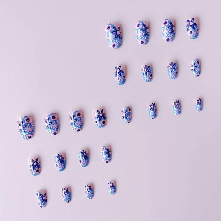 Nail art set with floral accents and vibrant patterns Bowlift