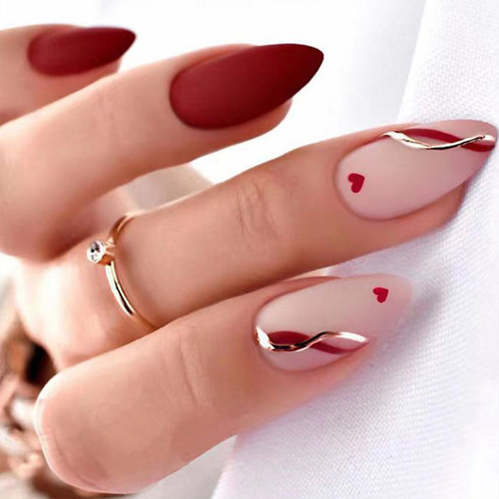 Artful stiletto nails with heart-shaped accents Bowlift