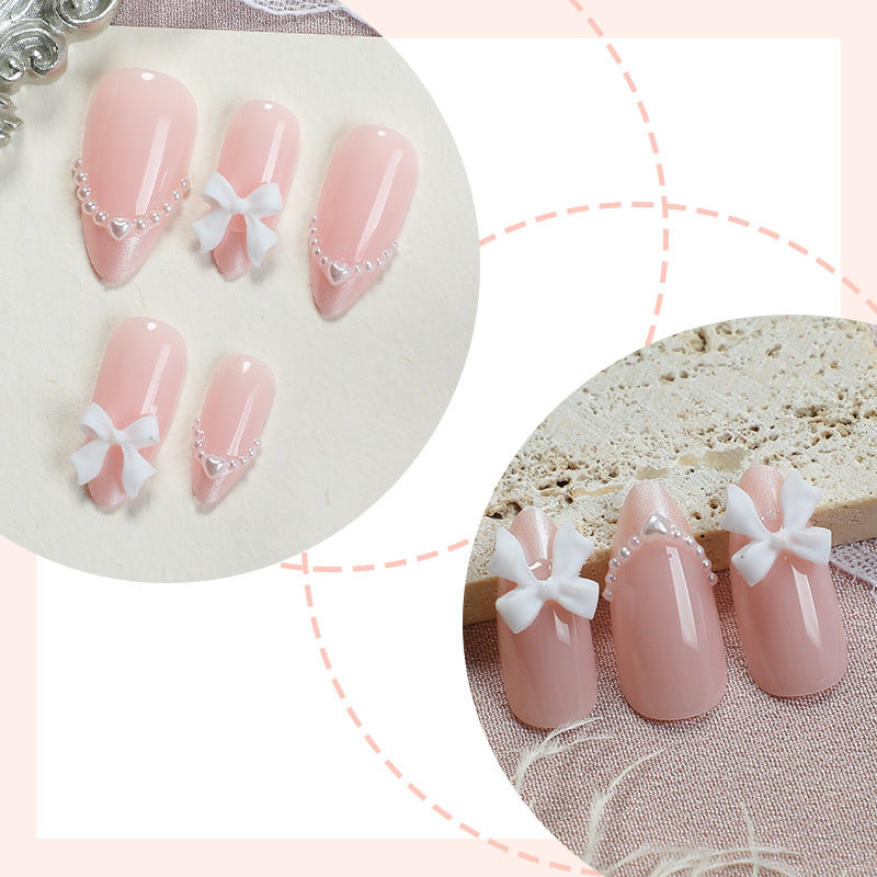 Artificial nail set with elegant bows and pearl embellishments Bowlift