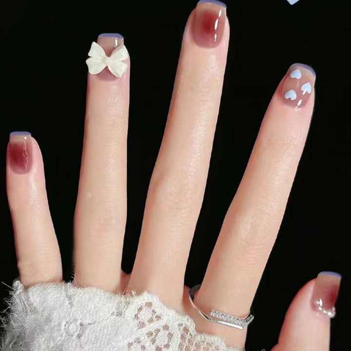 Artistic and elegant nail art with bow accents Bowlift
