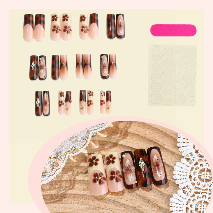 Nail set with floral accents and glitter accents Bowlift