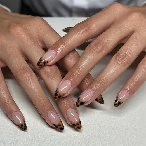 Acrylic nail set with elegant leopard design and gold accents Bowlift