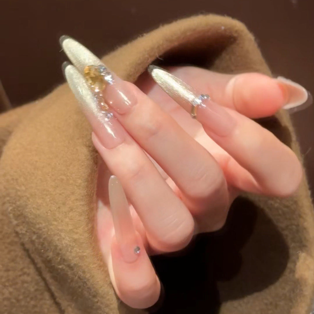 Artistic Stiletto Press-On Nail Art with Glimmering Accents Bowlift