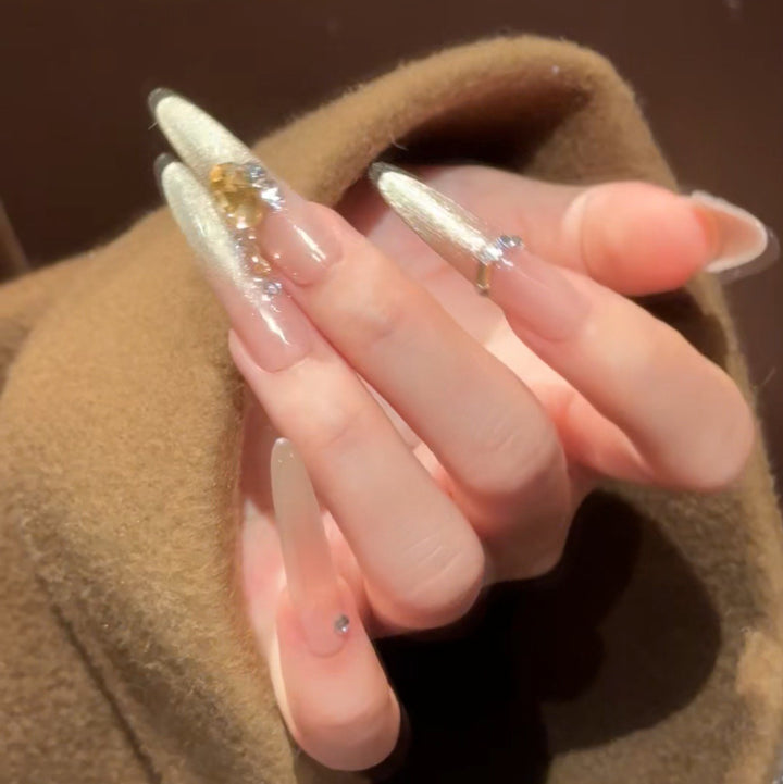 Artistic Stiletto Press-On Nail Art with Glimmering Accents Bowlift