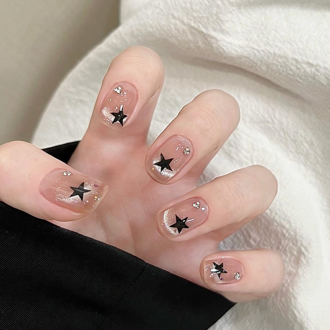 Artistic acrylic nails with glamorous star motifs Bowlift