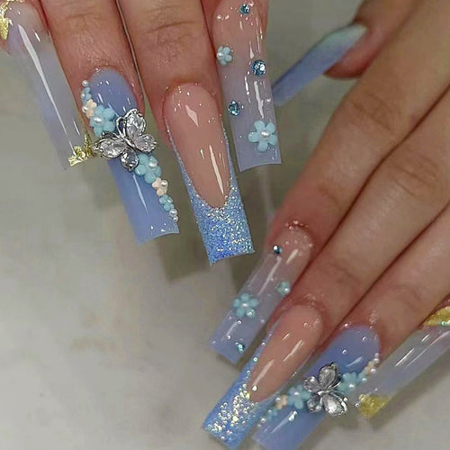 Artistic acrylic nails with flower and glitter design Bowlift