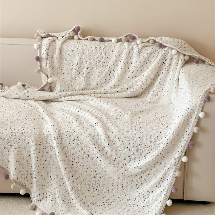 Extra soft cuddly throw blanket with pom-pom trim and mottled chenille relief Bowlift