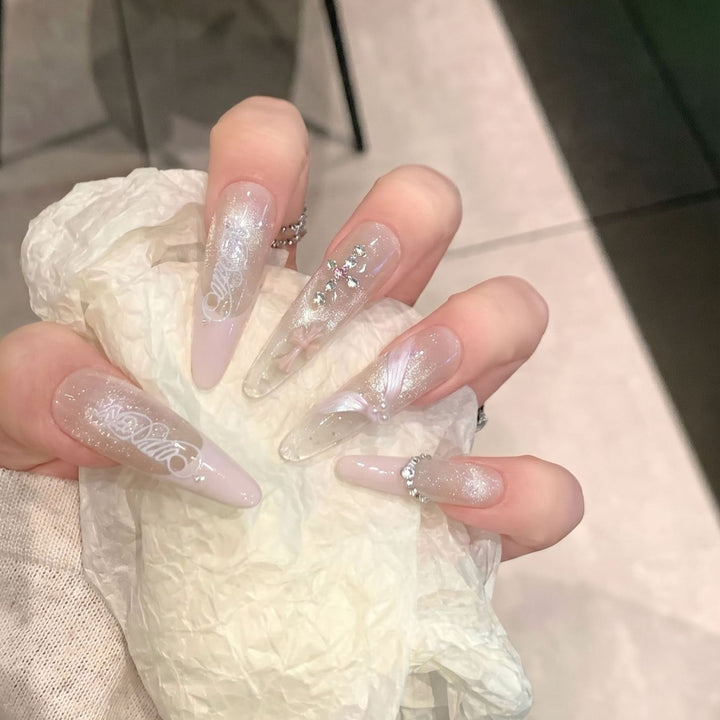 Elegant Stiletto Press-On Nail Set with Intricate Designs Bowlift