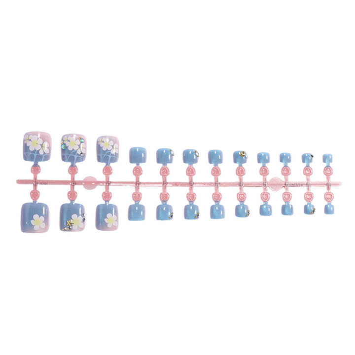 Artificial nail set with floral appliqués and glitter effects Bowlift
