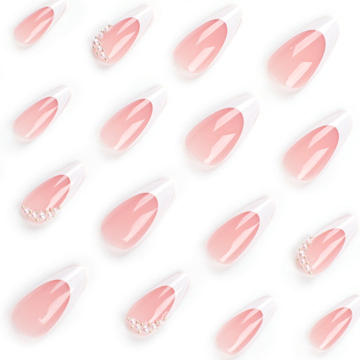 Artificial nail set with elegant French lace and pearl-decorated accents Bowlift