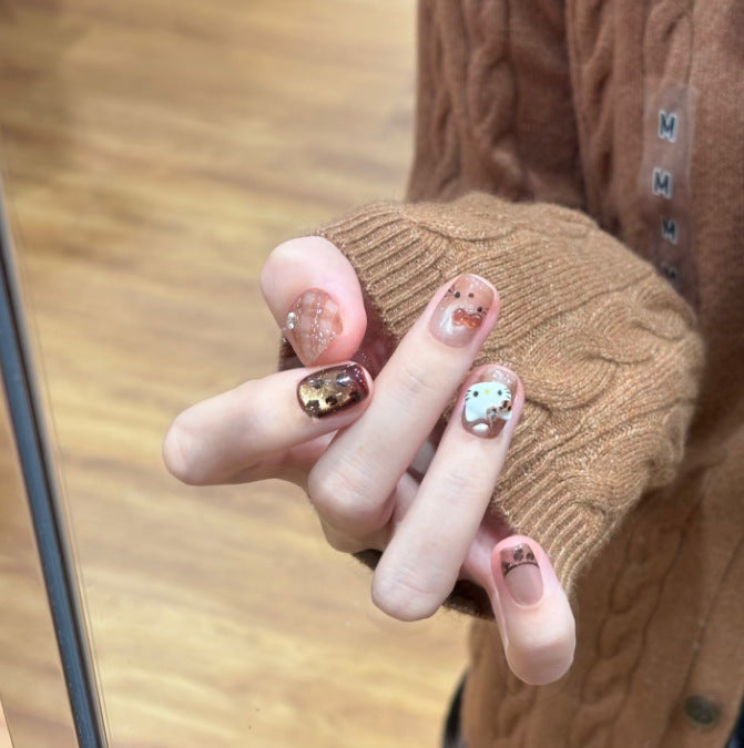 Artificial nail set with festive gift design and elegant glitter accents Bowlift
