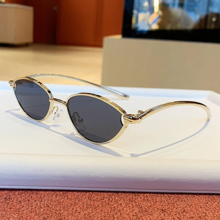 Women's designer sunglasses with elegant metal frame and protective lenses Bowlift