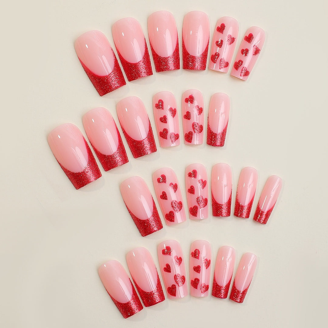 Acrylic nail set with glamorous heart designs and glitter accents Bowlift