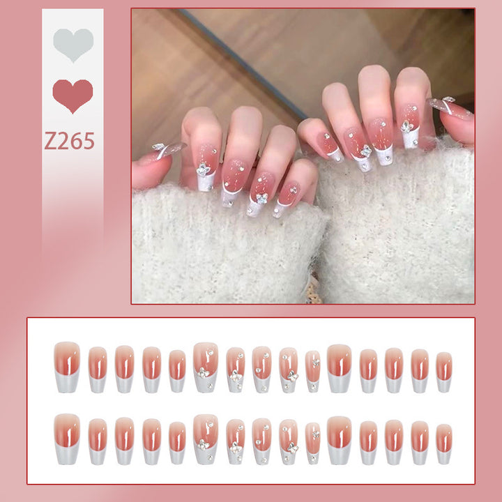 Nail art set with elegant wave patterns and delicate pearl accents Bowlift