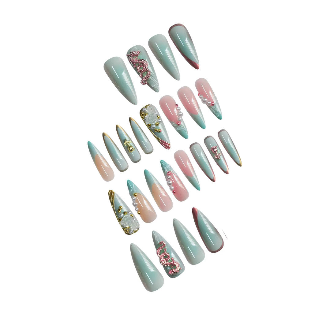 Luxurious Stiletto Nail Enhancements with Floral Accents Bowlift