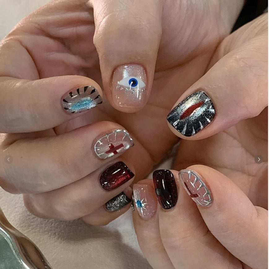 Artistic Press-On Nail Design Set with Unique Symbolic Accents Bowlift