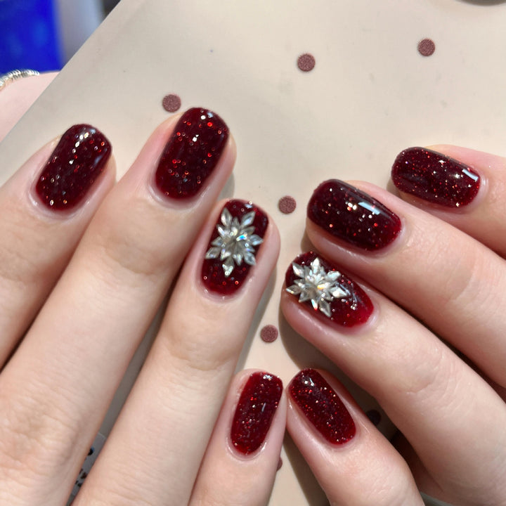 Glamorous artificial nails with rhinestone applications Bowlift