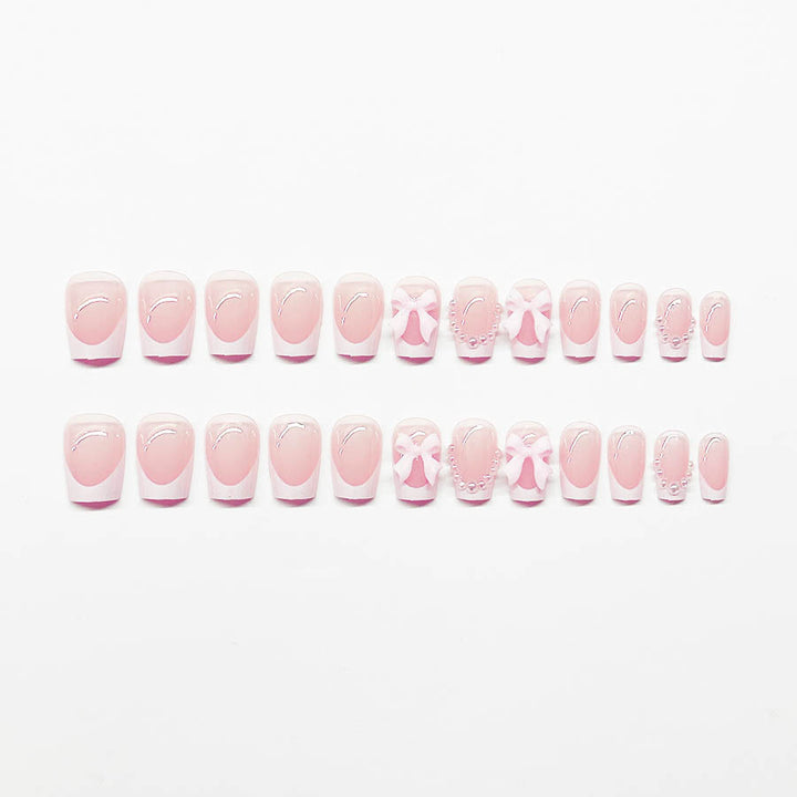 Artificial nails with elegant bows and pearl embellishments Bowlift