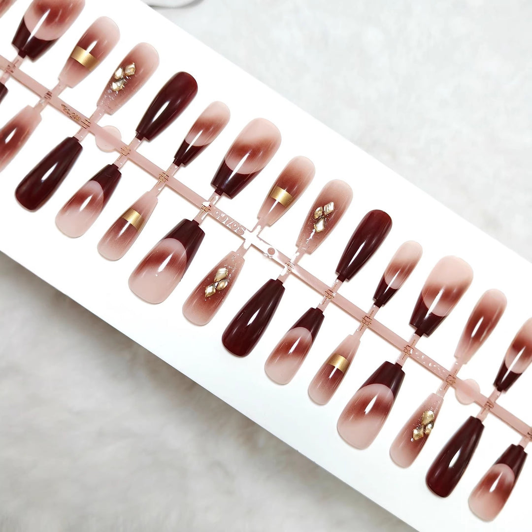 Artificial nails with elegant color gradients and jewelry details Bowlift