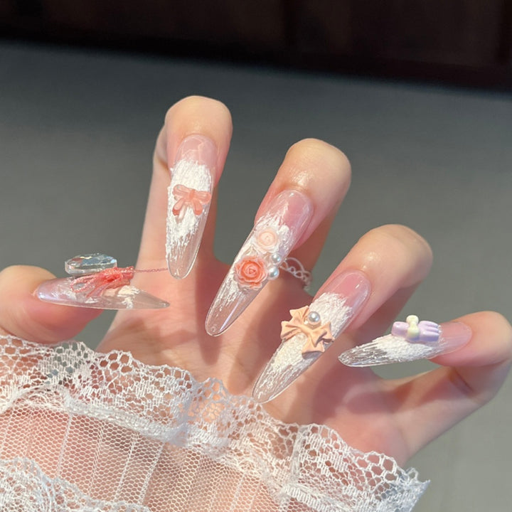 Artistic Stiletto Press-On Nail Art with Glimmering Accents Bowlift