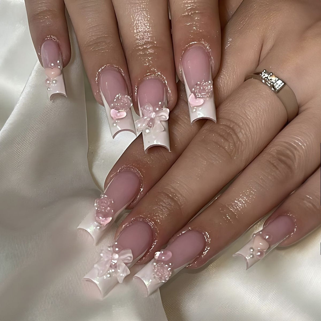 Creative acrylic nail set with delicate pearl and gloss accents Bowlift