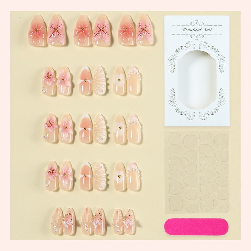 Creative nail art set with delicate flower and glitter embellishments Bowlift