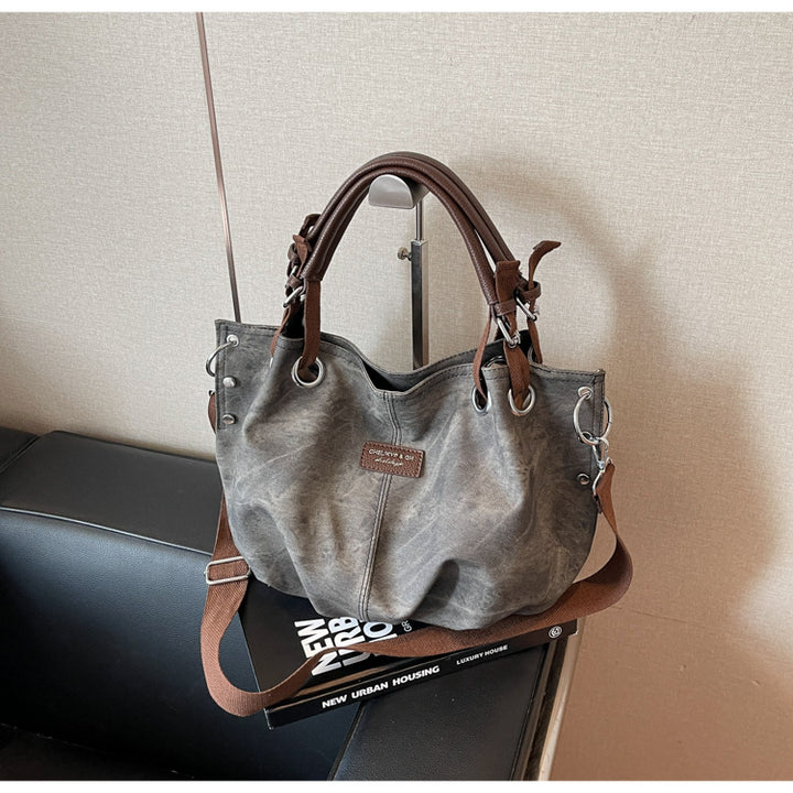 Everyday handbag with innovative carrying system Bowlift