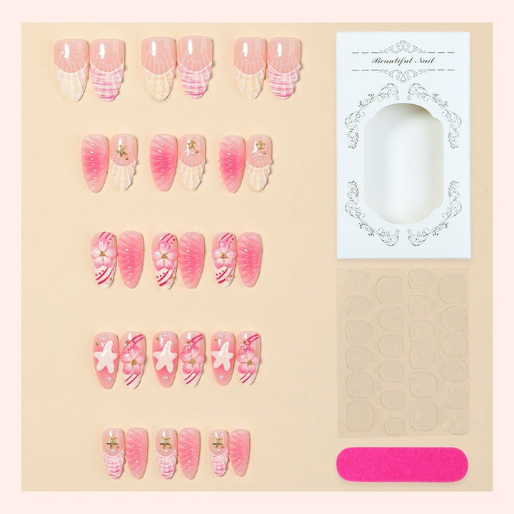 Artificial nail set with maritime shell and flower design Bowlift