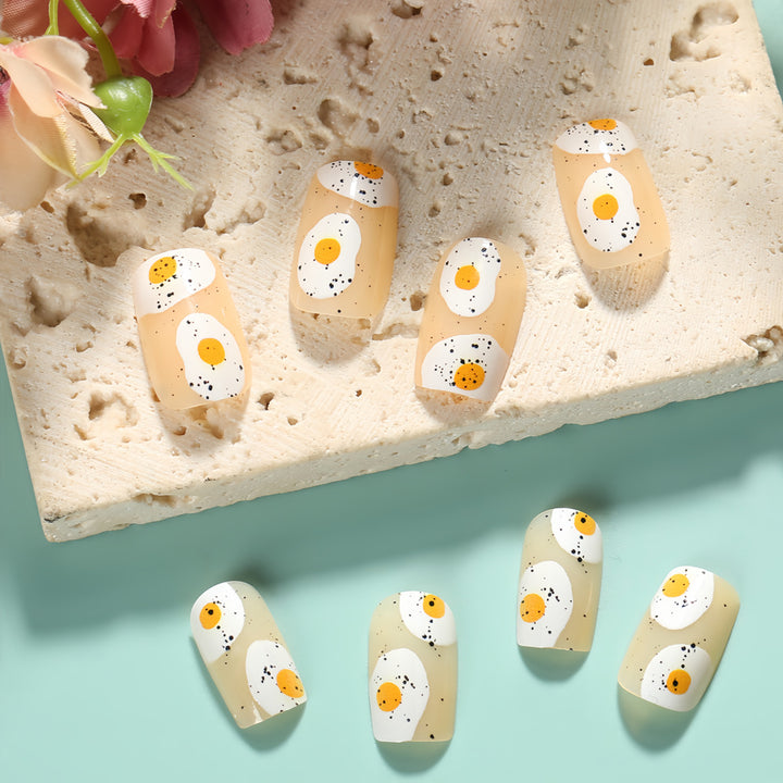 Artificial nails in creative fried egg design Bowlift