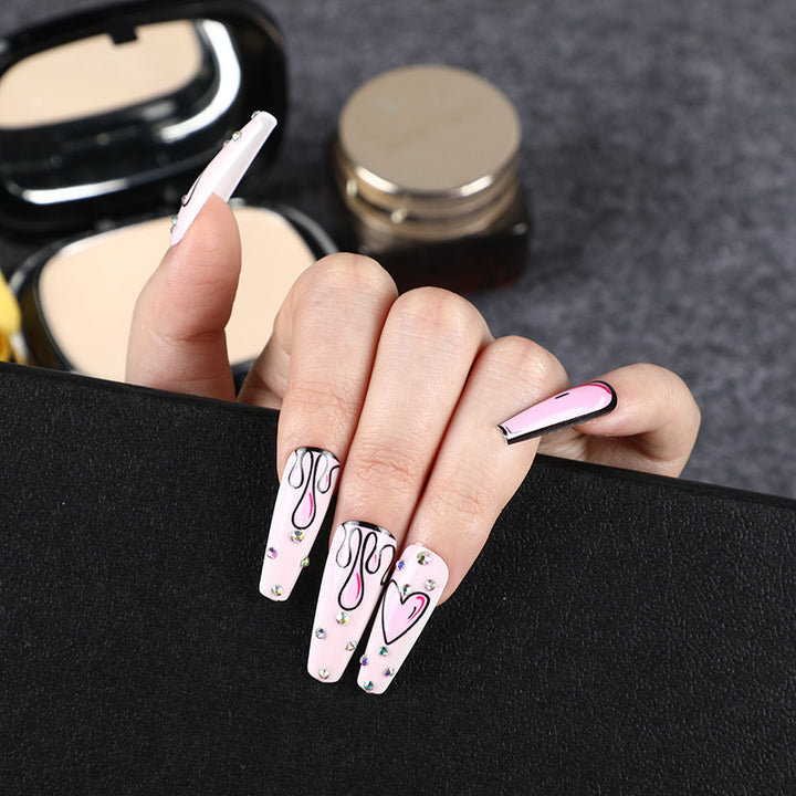 Eye-catching artificial nails with soulful heart design and glamorous accents Bowlift