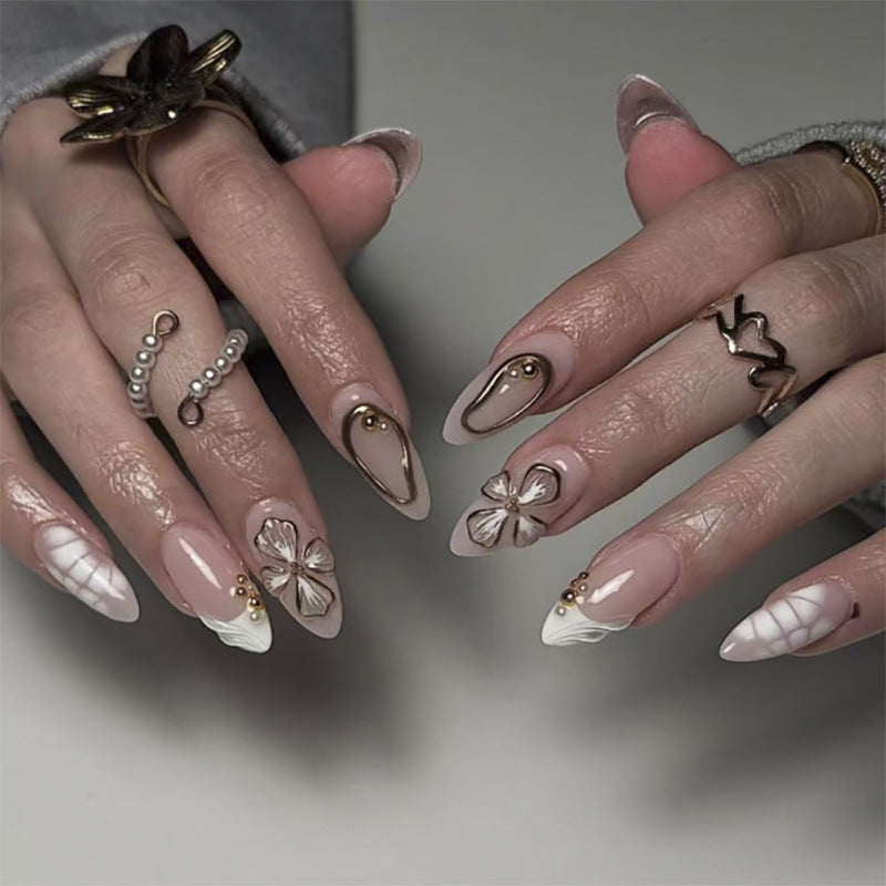 Artful stiletto nails with floral and shimmering decor Bowlift
