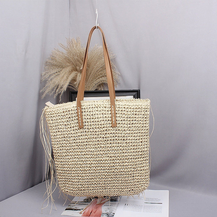 Handwoven beach bag made of natural materials with leather accents Bowlift