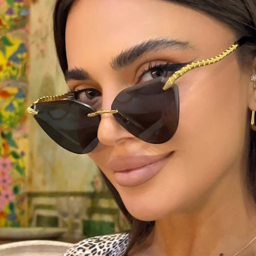 Women's Cat-Eye Sunglasses with unique gold frame design and protective lenses Bowlift