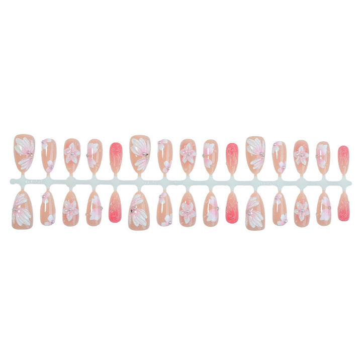 Artificial nail set with floral motifs and rhinestone decorations Bowlift