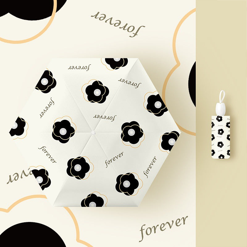Ladies folding umbrella with playful flower design Bowlift