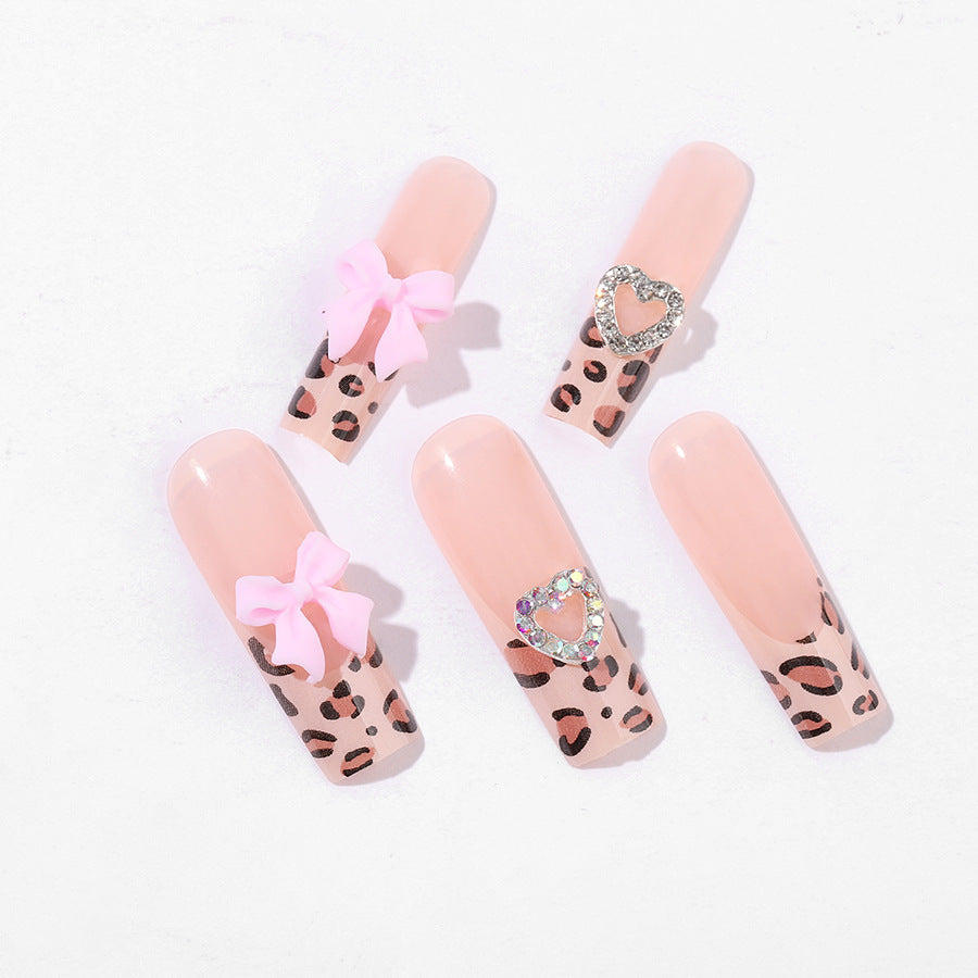 Creative nail set with leopard pattern and bow accents Bowlift