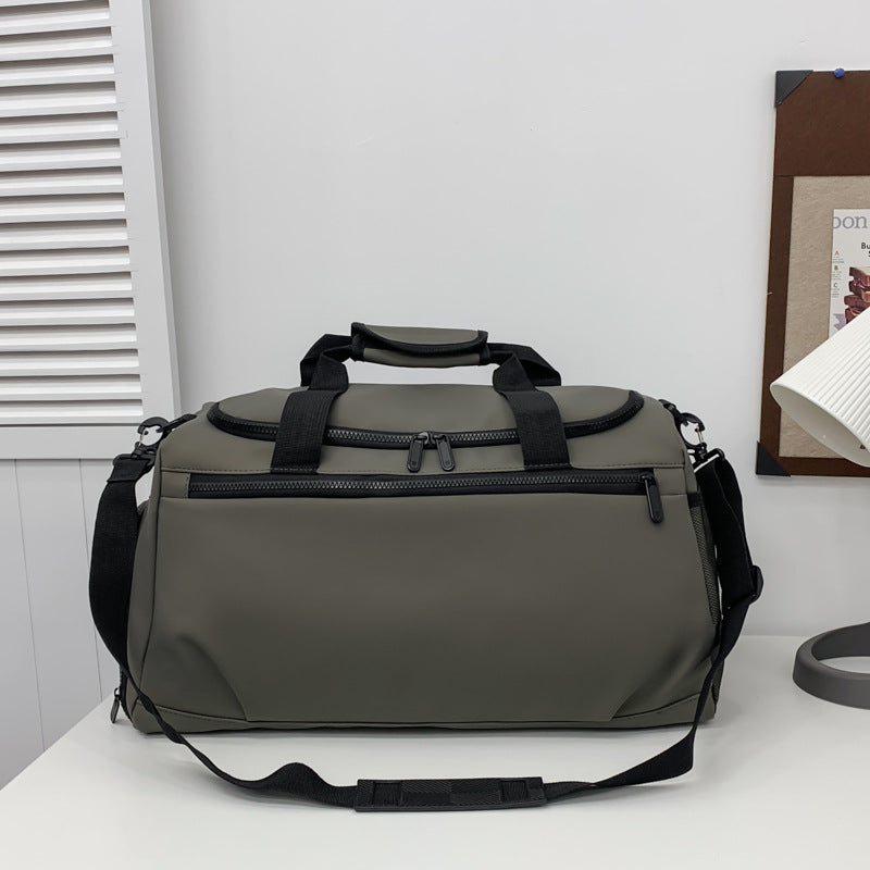 Sporty travel bag with reinforced carrying handles and multiple compartments Bowlift