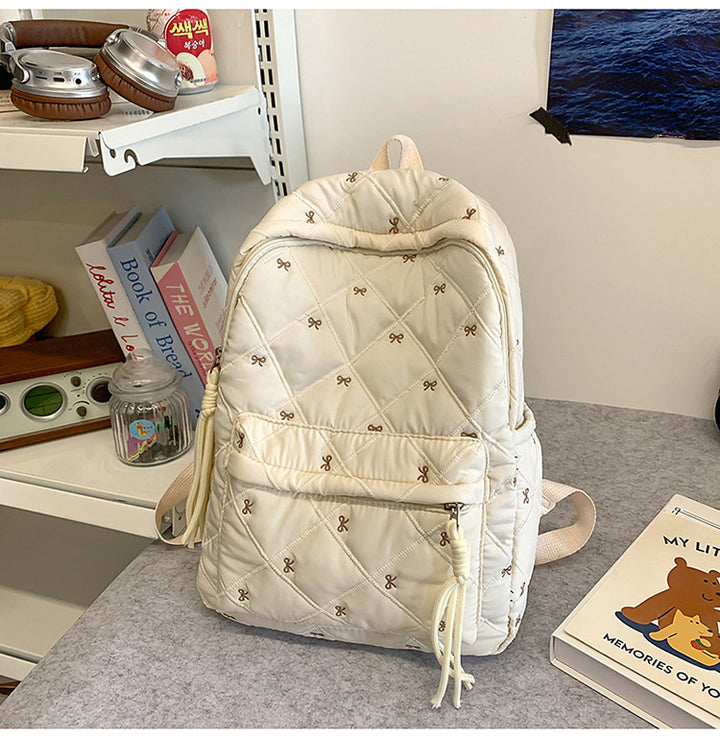 Quilted Backpack with Decorative Tassels
