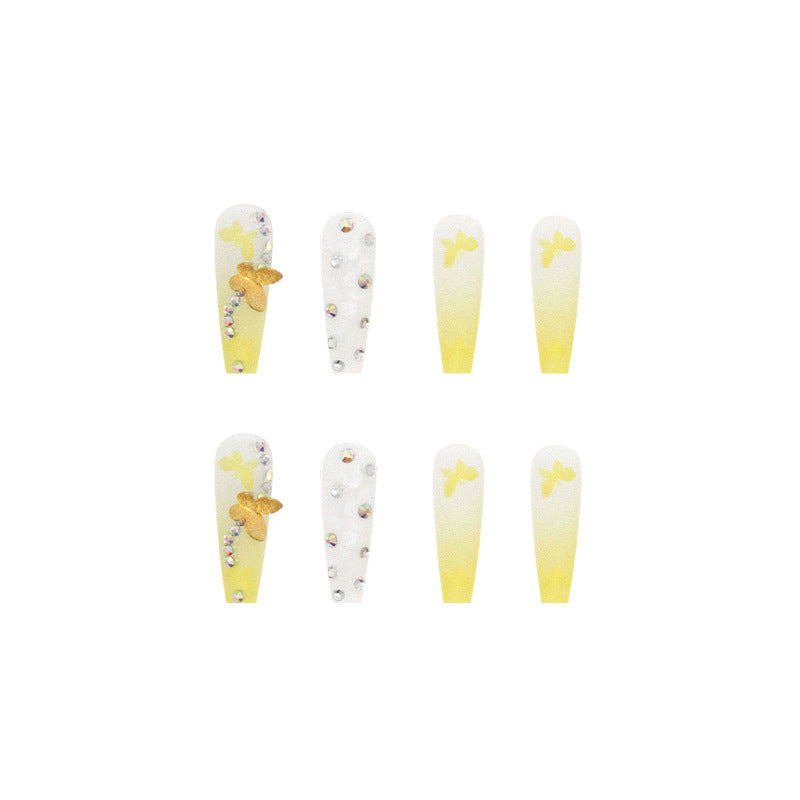 Artificial nail extensions with floral accents and rhinestones Bowlift