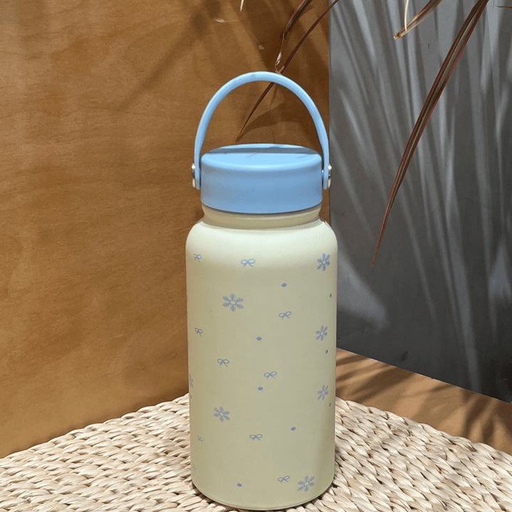 Women's insulated drinking bottle with practical carrying handle and cheerful design Bowlift