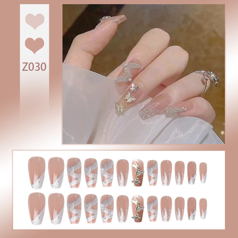 Artificial nail set with sparkling butterflies and glittering decorations Bowlift