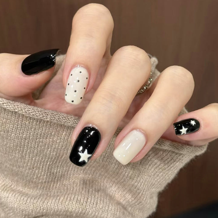 Artistic Press-On Nail Design with Stars and Polka Dots Bowlift