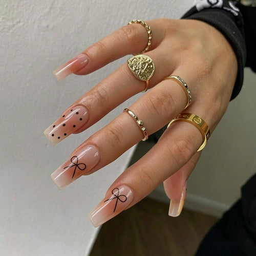 Artificial nails with modern dot design and elegant accents Bowlift