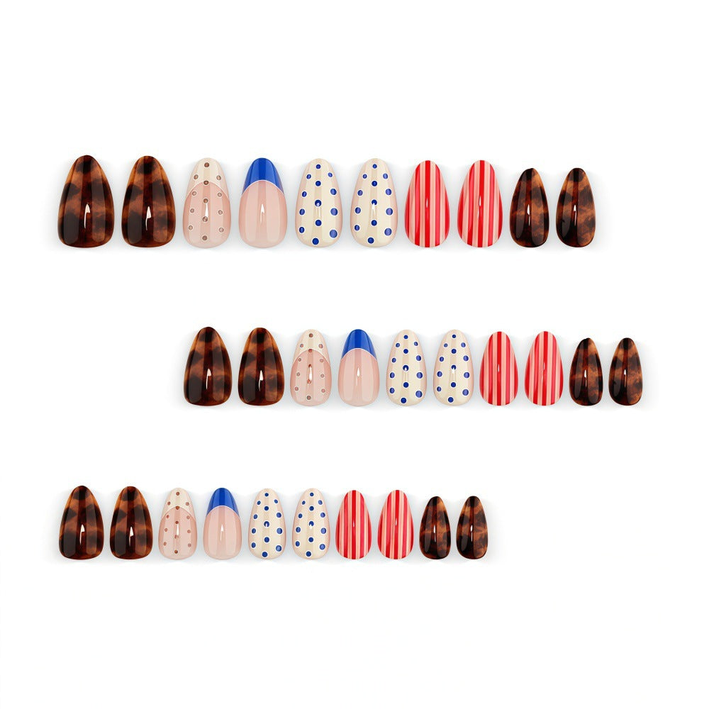 Fake nails in playful design with dots and stripes Bowlift