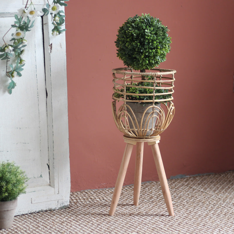 Stylish plant stand made of rattan and wood Bowlift