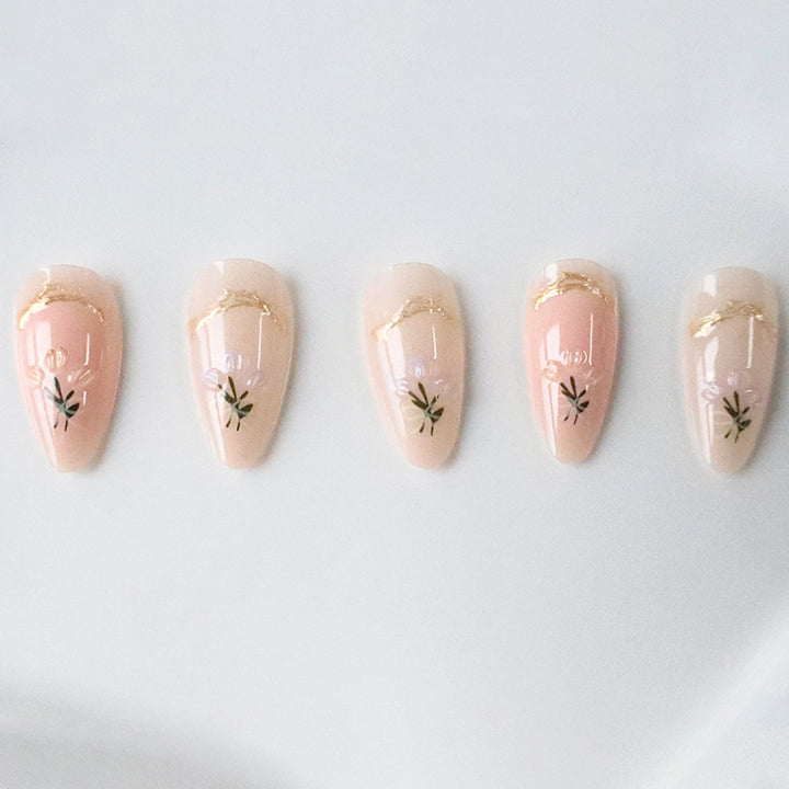 Artistic Long Almond-Shaped Nail Art Enhancements Bowlift