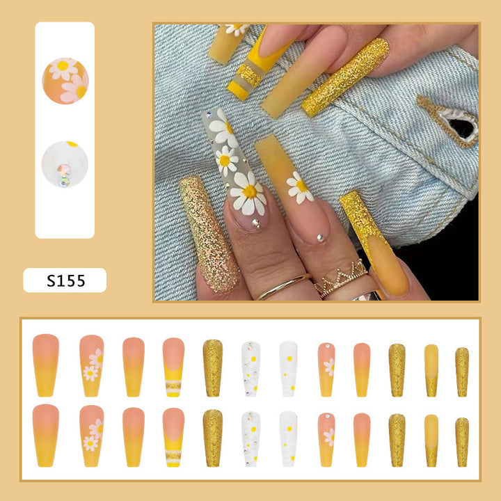 Artificial nail set with colorful sunflower designs and glittering accents Bowlift