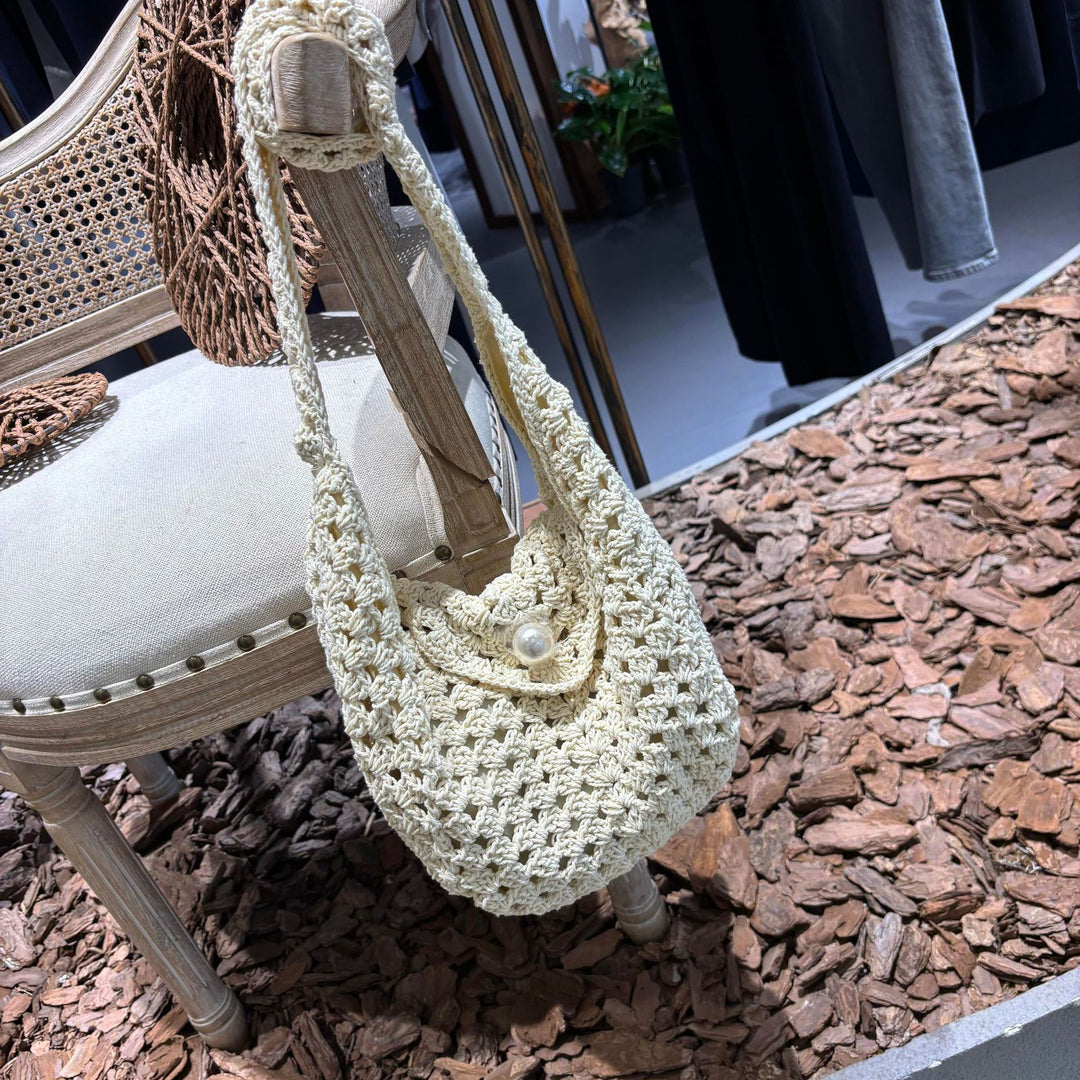 Hand-knotted shoulder bag with bead closure Bowlift