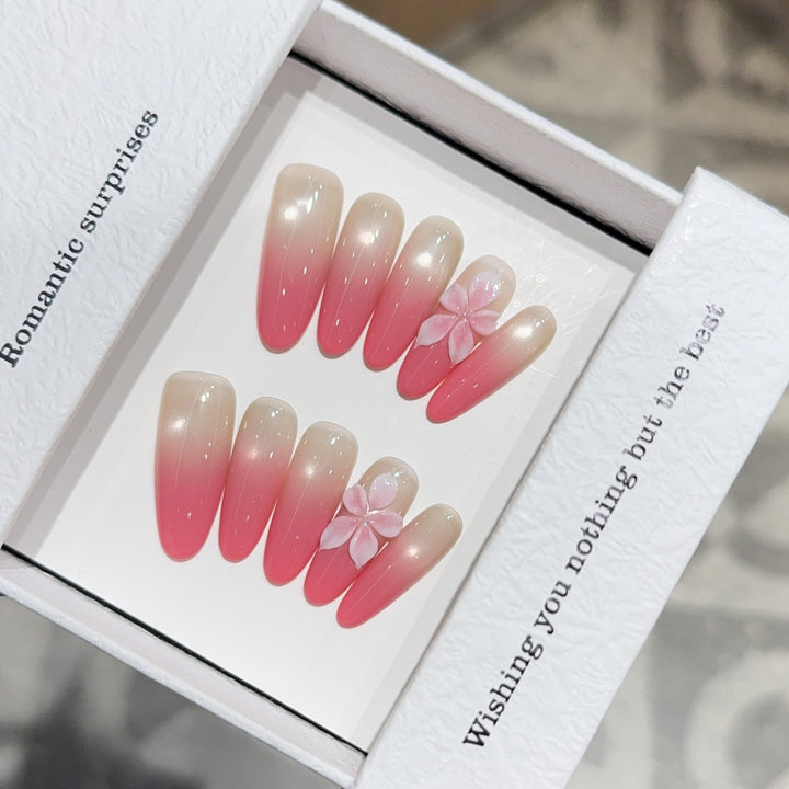 Artificial nails with romantic ombre design and floral accents Bowlift
